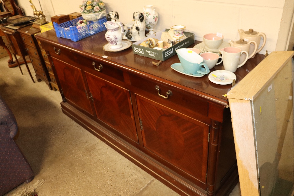 A modern mahogany and cross banded sideboard