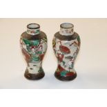 A pair of Oriental crackled glazed vases with cha