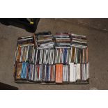 A box of various CD's