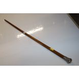 An ash walking stick with silver cap