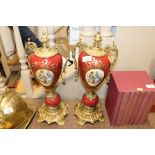 A pair of porcelain urns