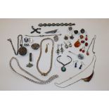 A box containing silver necklace, white metal and