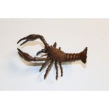 A bronzed model of a lobster