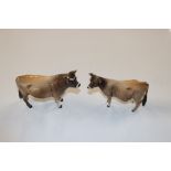 A Beswick model of a bull and another of a cow, bo
