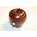 A wooden tea caddy in the form of an apple