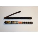 Two wooden truncheons, one with painted decoration