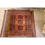 An approx. 3'3" x 4'7" orange pattern rug