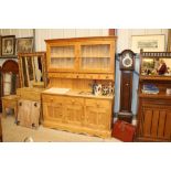 A stripped pine dresser fitted three drawers