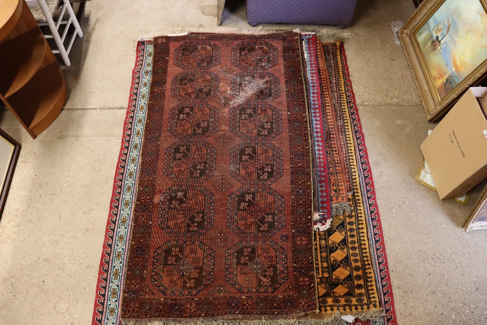 An approx. 3'3" x 6'3" red and blue pattern rug