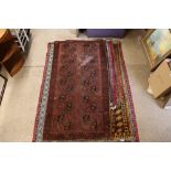 An approx. 3'3" x 6'3" red and blue pattern rug