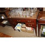 A mahogany desk fitted five drawers raised on squa