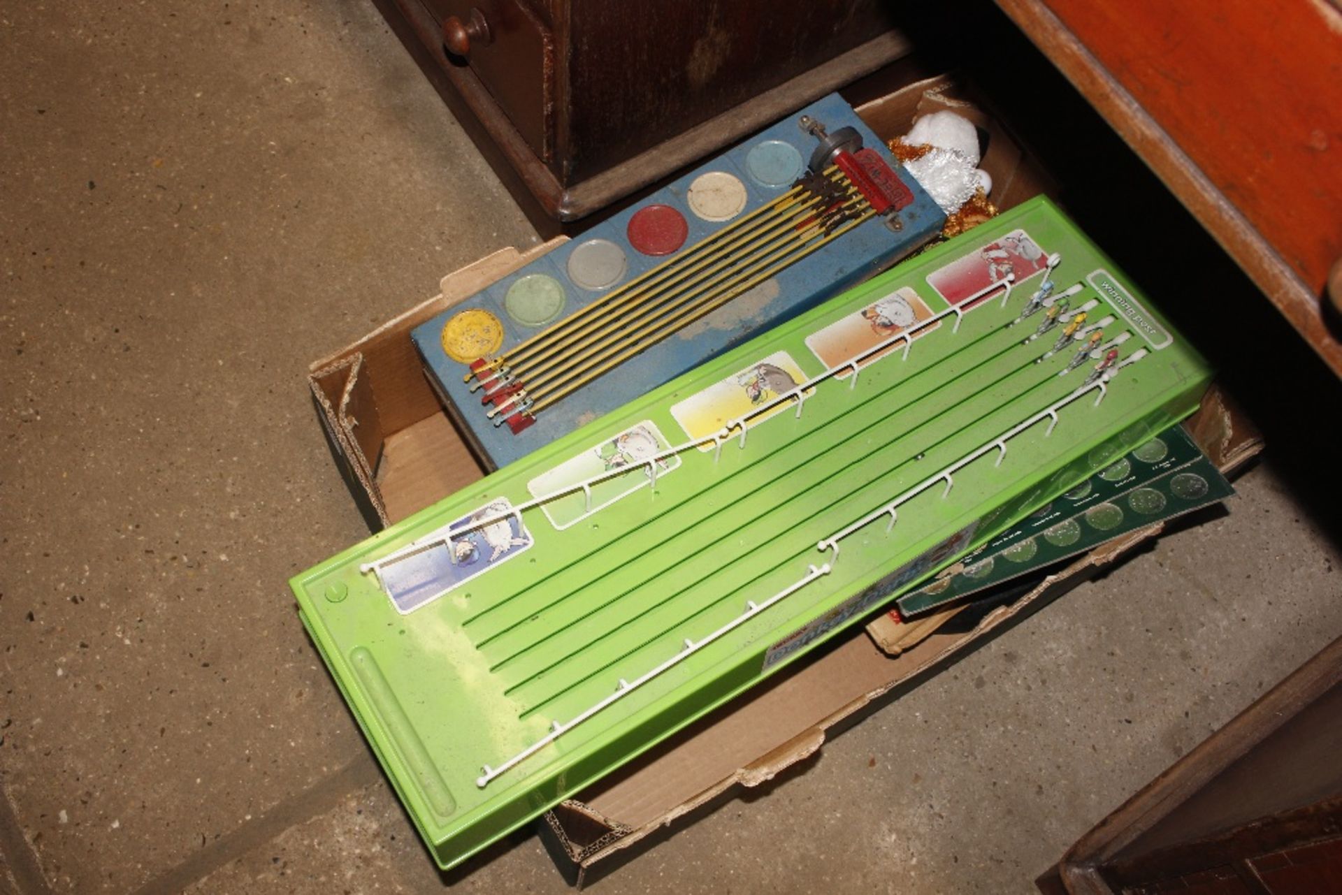 A box of various vintage and other games