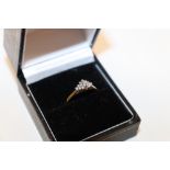 A 9ct gold and chip diamond set cluster ring, lack