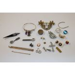 A box of jewellery including yellow metal bangle,