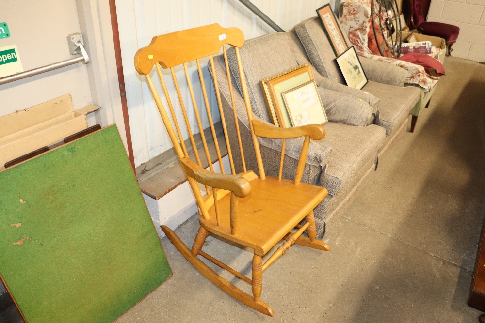 A beech stick back rocking chair