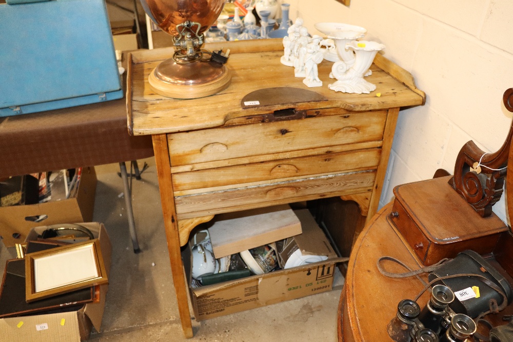 A stripped pine tray top worktable fitted three dr