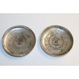 A pair of Oriental white metal dishes inset with c