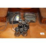 Two pairs of binoculars in fitted case