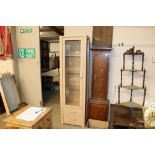 A light oak effect display cabinet