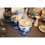 A pair of silver plated porcelain biscuit barrels