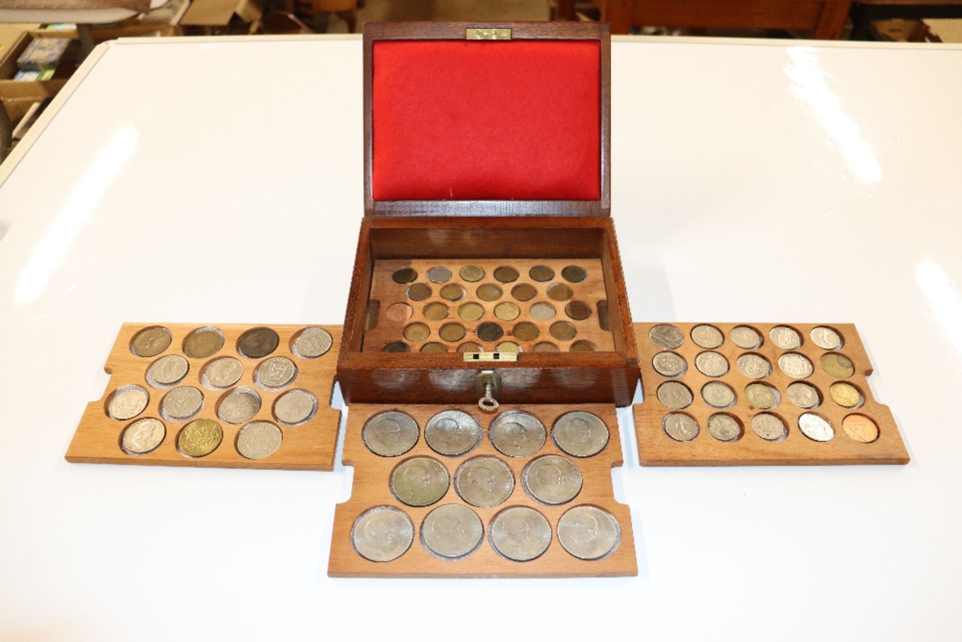 A box containing Churchill crowns, 1 shilling piec