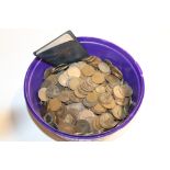 A tub of miscellaneous copper coinage