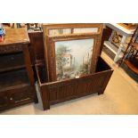 A linen fold decorated oak blanket box