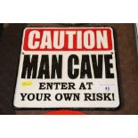 A cast sign "Man Cave"
