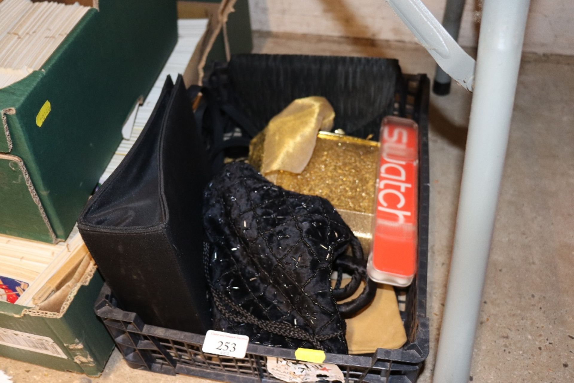A box containing ladies purses and bags