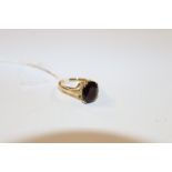 An 18ct gold and garnet set ring, approx. 5gms tot