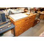 A pine multi drawer sideboard