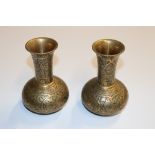 A pair of heavy brass vases