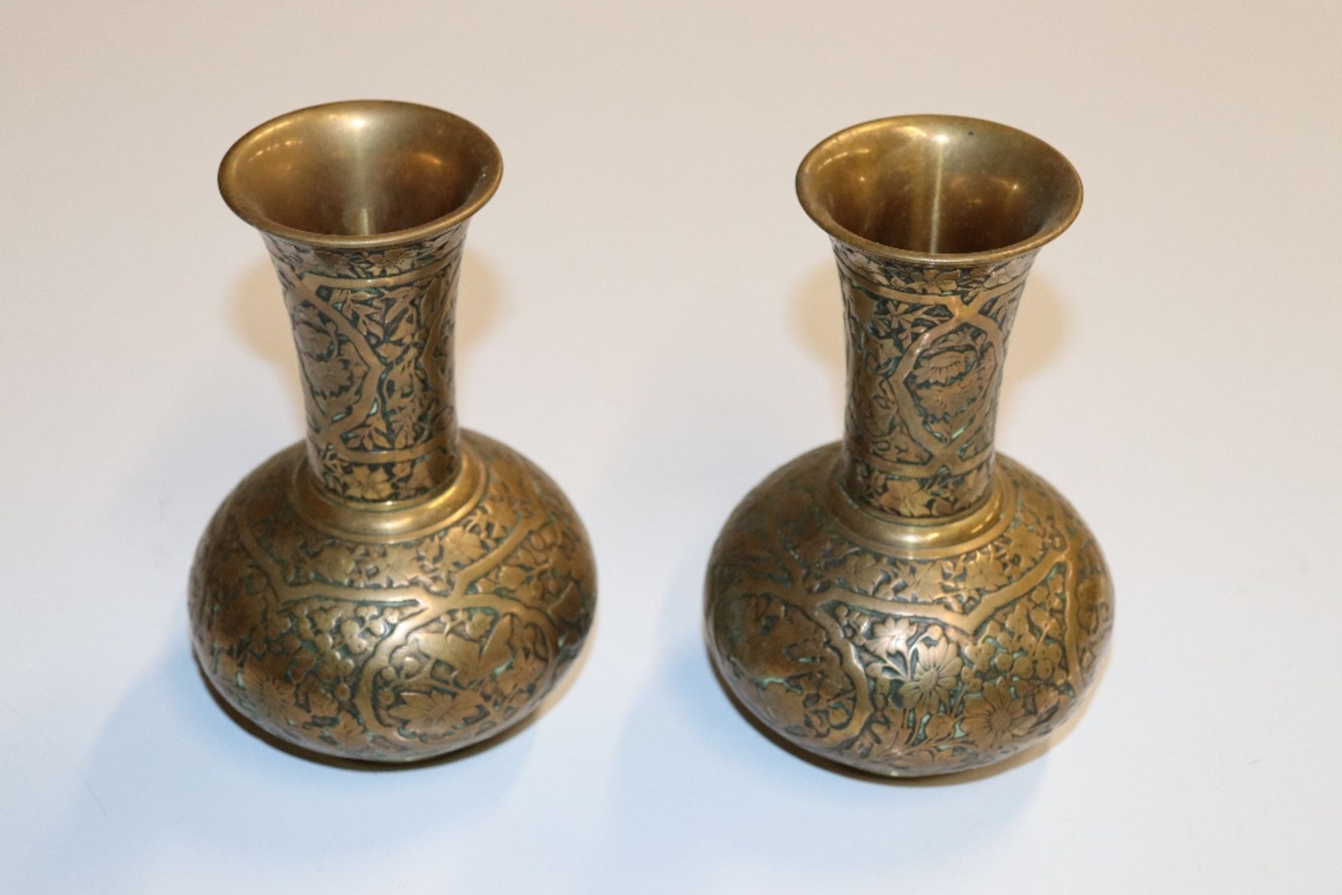 A pair of heavy brass vases