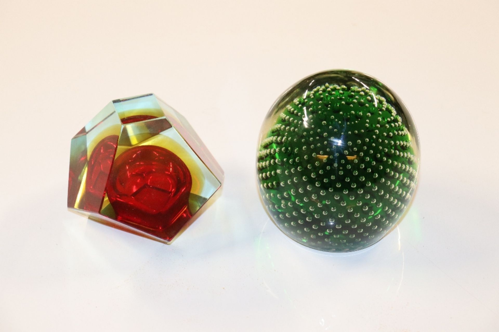 A heavy bubble glass paperweight and an Art Glass