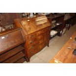 A 19th Century walnut and cross banded bureau fitt