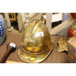 A brass Fireman's helmet with leather lining