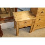 A stripped pine bedside table fitted two drawers