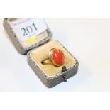 An 18ct gold and coral set ring, approx. 5gms