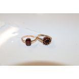 A 9ct gold garnet set ring, approx. 1.5gms; and a