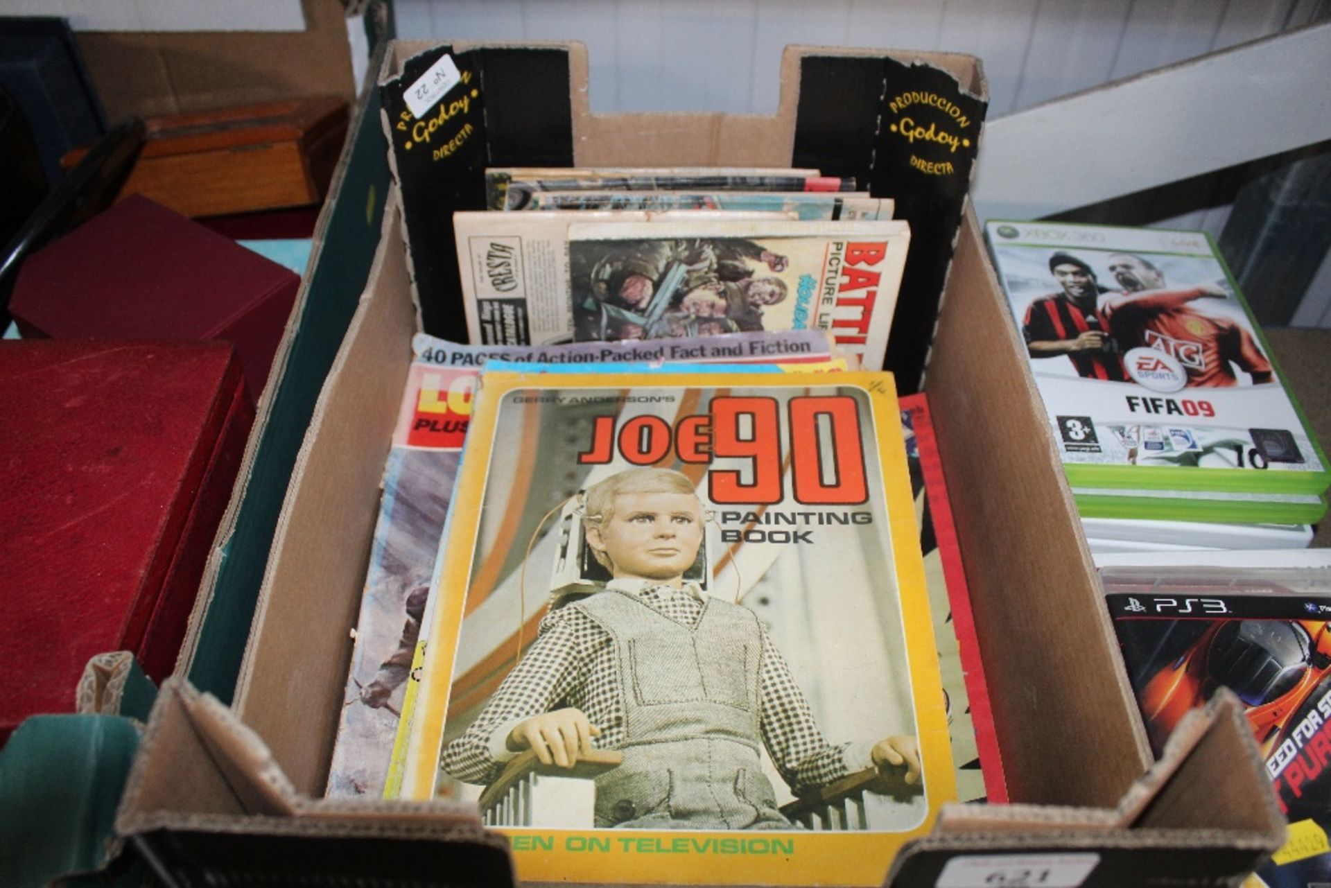 A box of comics and painting book