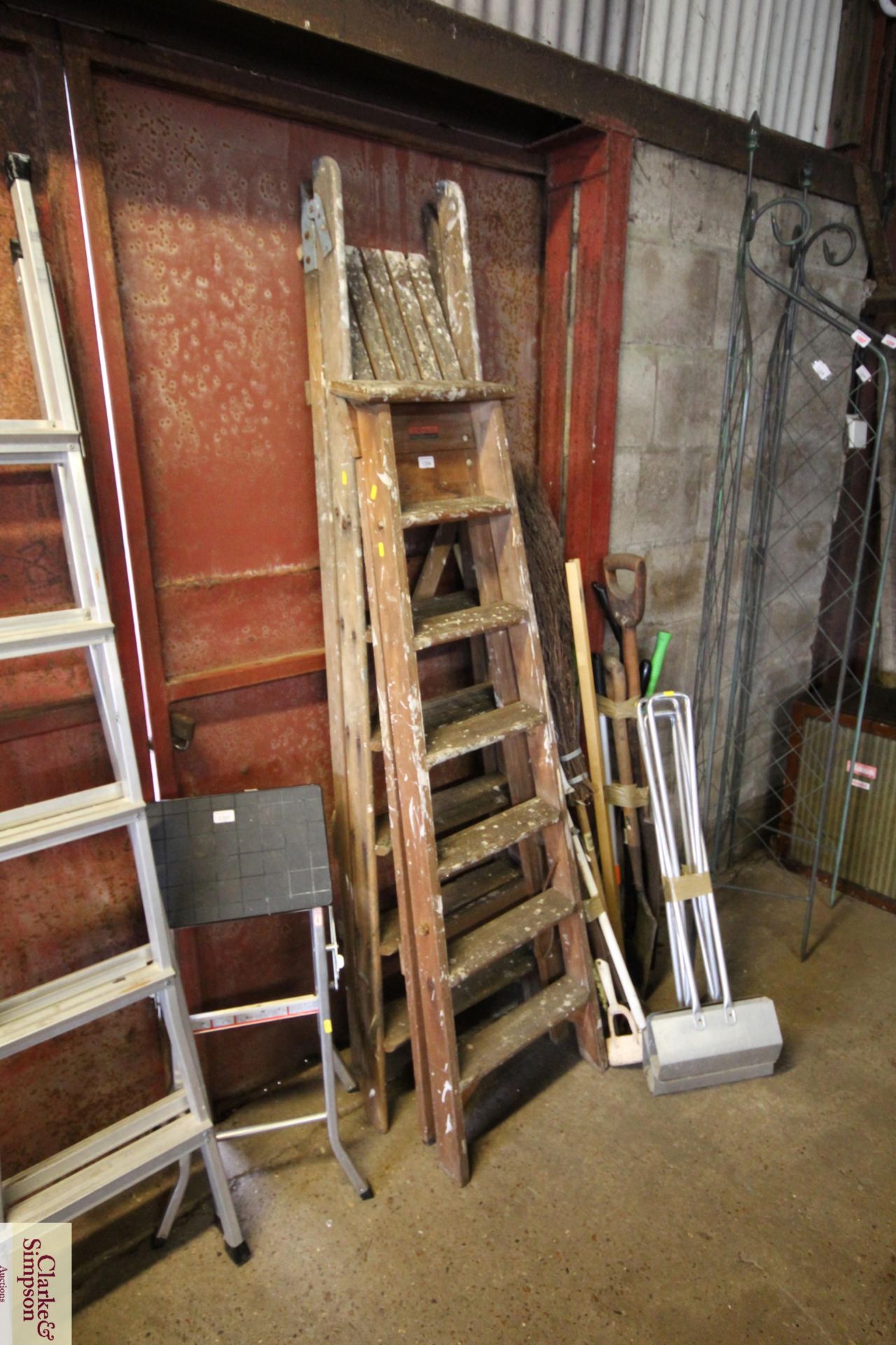 Two wooden folding step ladders