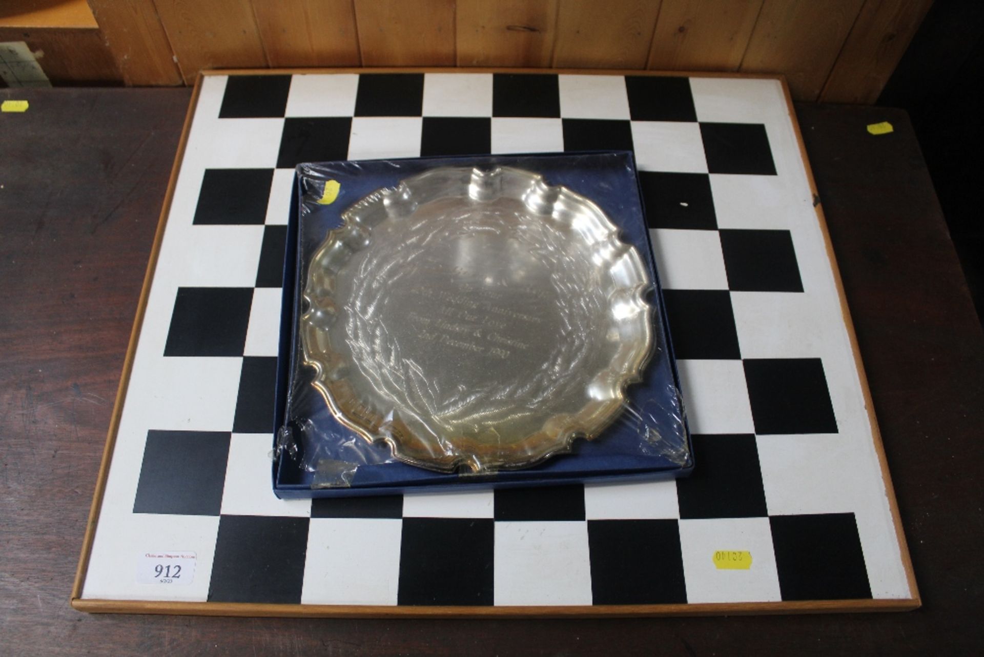 A chess board and silver plated tray