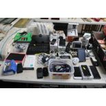 A collection of mobile phones; SatNavs; tablet etc