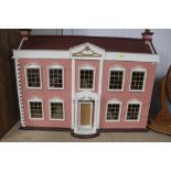 A dolls house and contents of various furniture