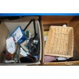 Two boxes containing various picture frames; wicke