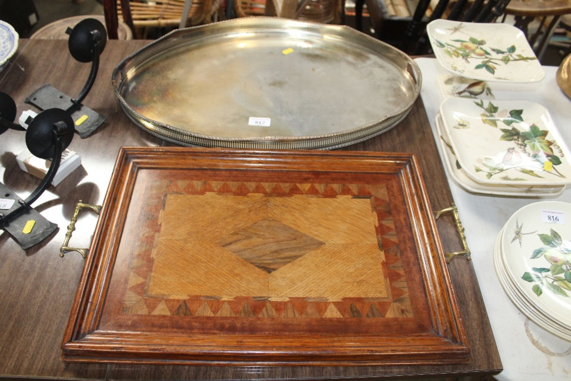 A wooden inlaid twin handled tray and a silver pla