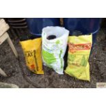 Three bags of plastic plant pots