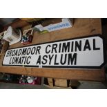 A reproduction wooden sign "Broadmoor Criminal Lun