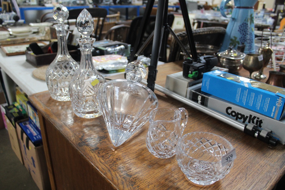 Two cut glass decanters and stoppers; one other de