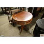 A reproduction yew wood drum table AF